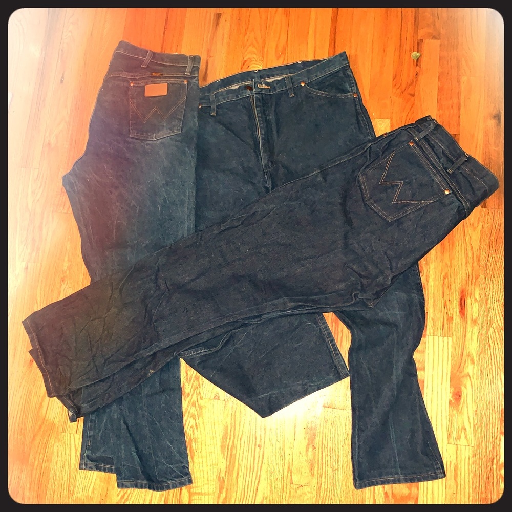 Two pairs of MENS Wrangler jeans.